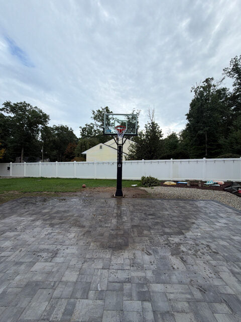 Paver play surface after rainfall showing how water moves across and off the playing area