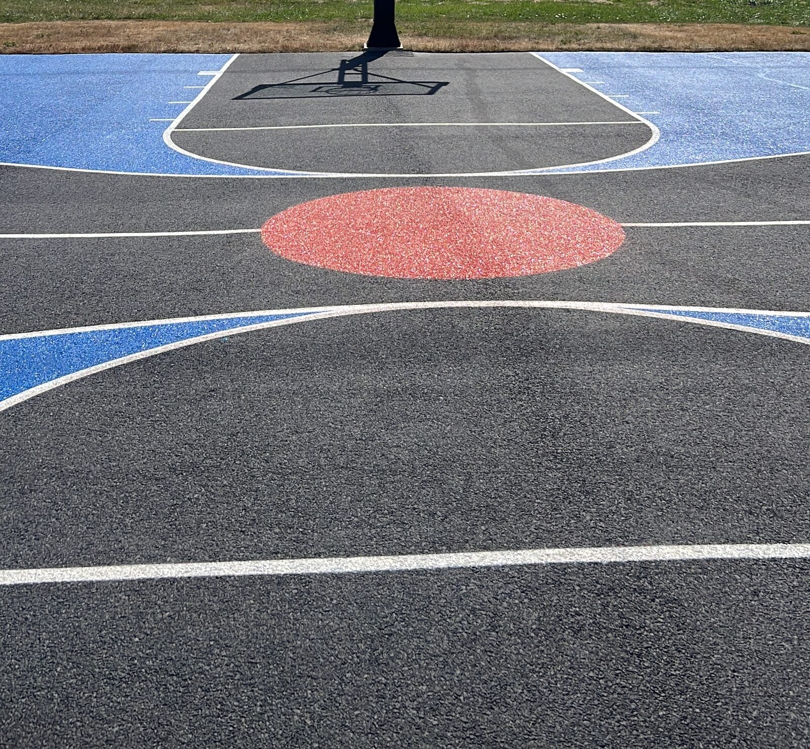 Painted key and free-throw area on a residential basketball court